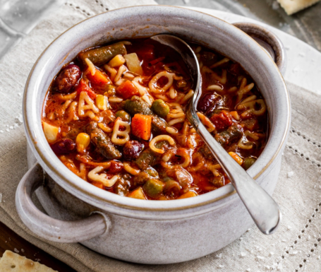 Alphabet soup bowl representing the confusing mix of acronyms like 403(b) vs 457(b) for Texas Teachers